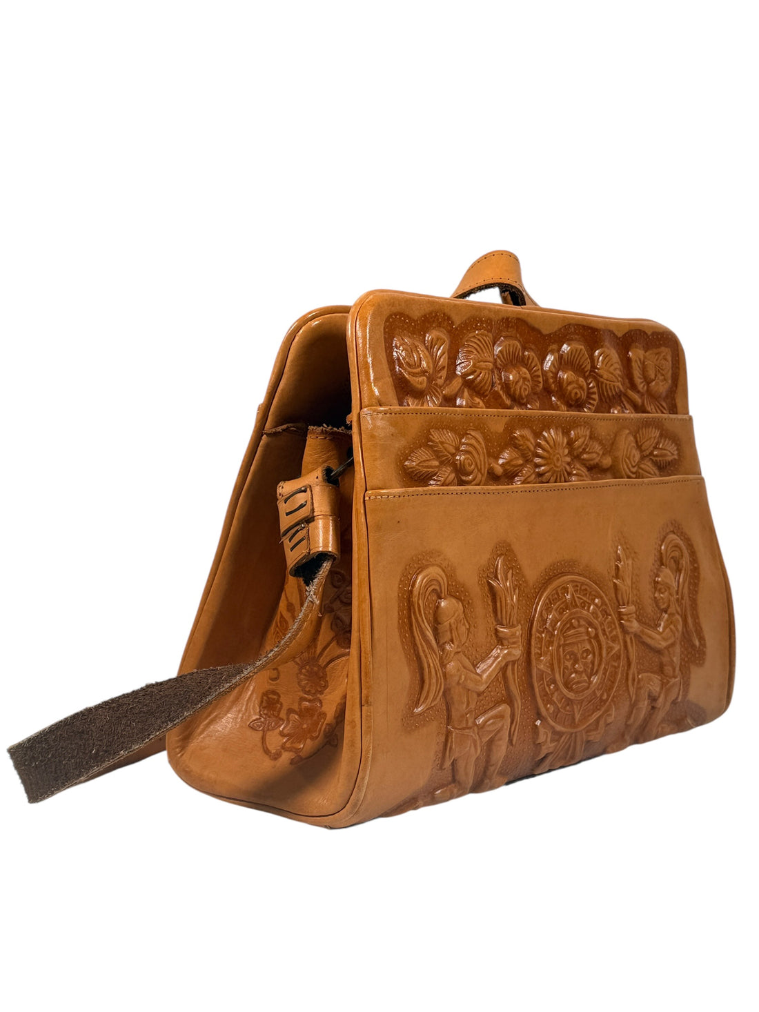 Vintage tooled leather handbag with Aztec motif. Mexican artisan carved shoulder purse, structured boho accessory with strong vintage character and collector appeal.