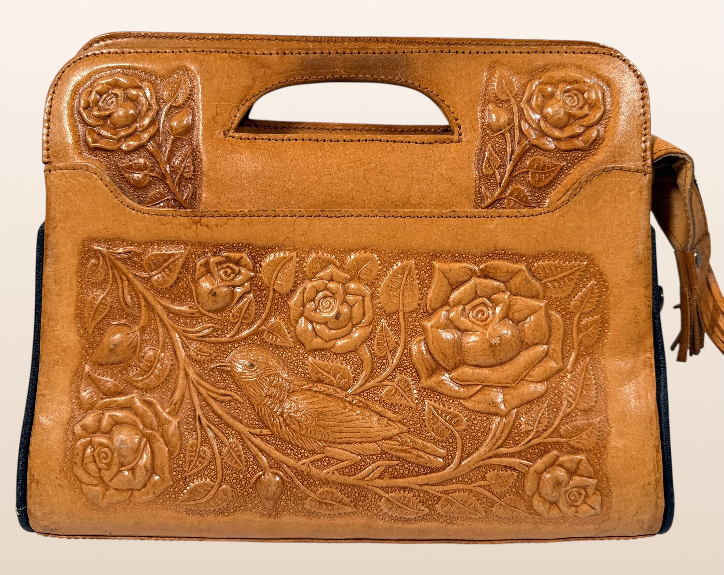 Vintage Mexican tooled leather handbag with Aztec calendar motif, floral embossing, detachable strap, classic artisan leather purse with strong vintage appeal.