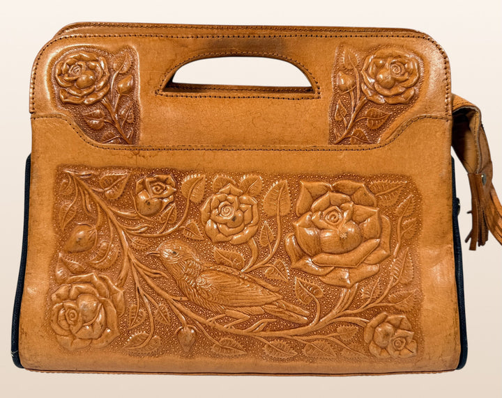 Vintage Mexican tooled leather handbag with Aztec calendar motif, floral embossing, detachable strap, classic artisan leather purse with strong vintage appeal.