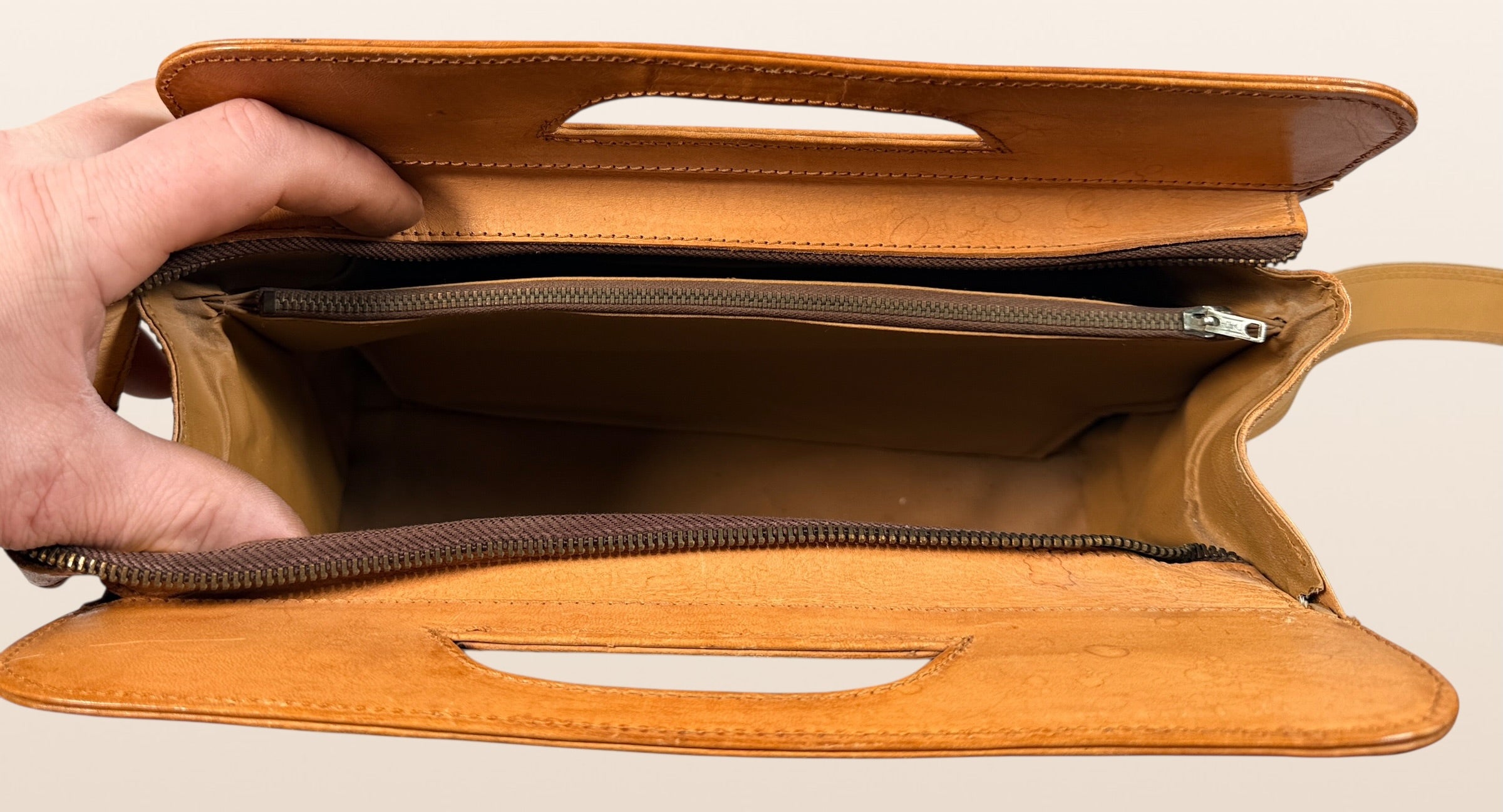 Vintage Mexican tooled leather handbag with Aztec calendar motif, floral embossing, detachable strap, classic artisan leather purse with strong vintage appeal.