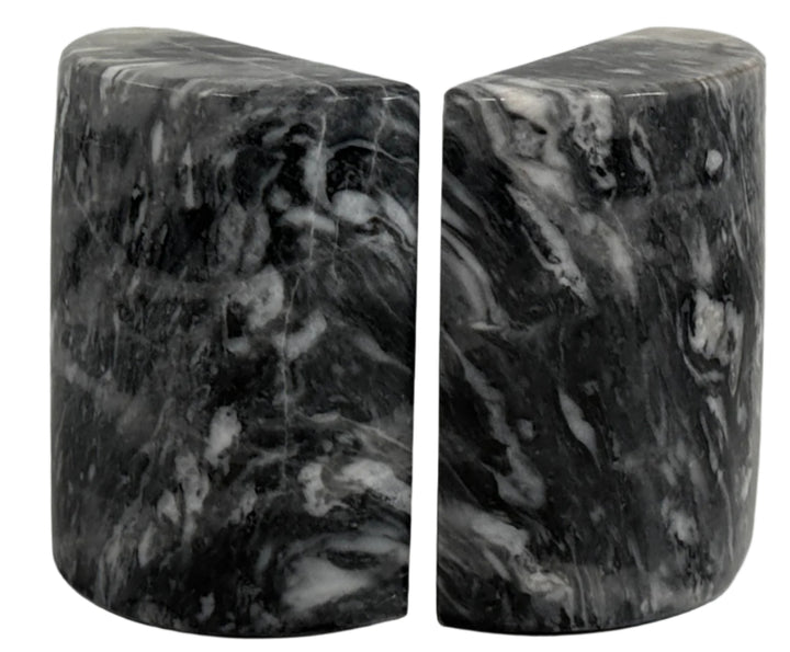 Marble bookends on a white surface with a light gray background