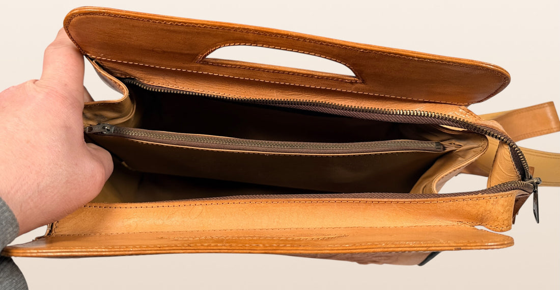 Vintage Mexican tooled leather handbag with Aztec calendar motif, floral embossing, detachable strap, classic artisan leather purse with strong vintage appeal.