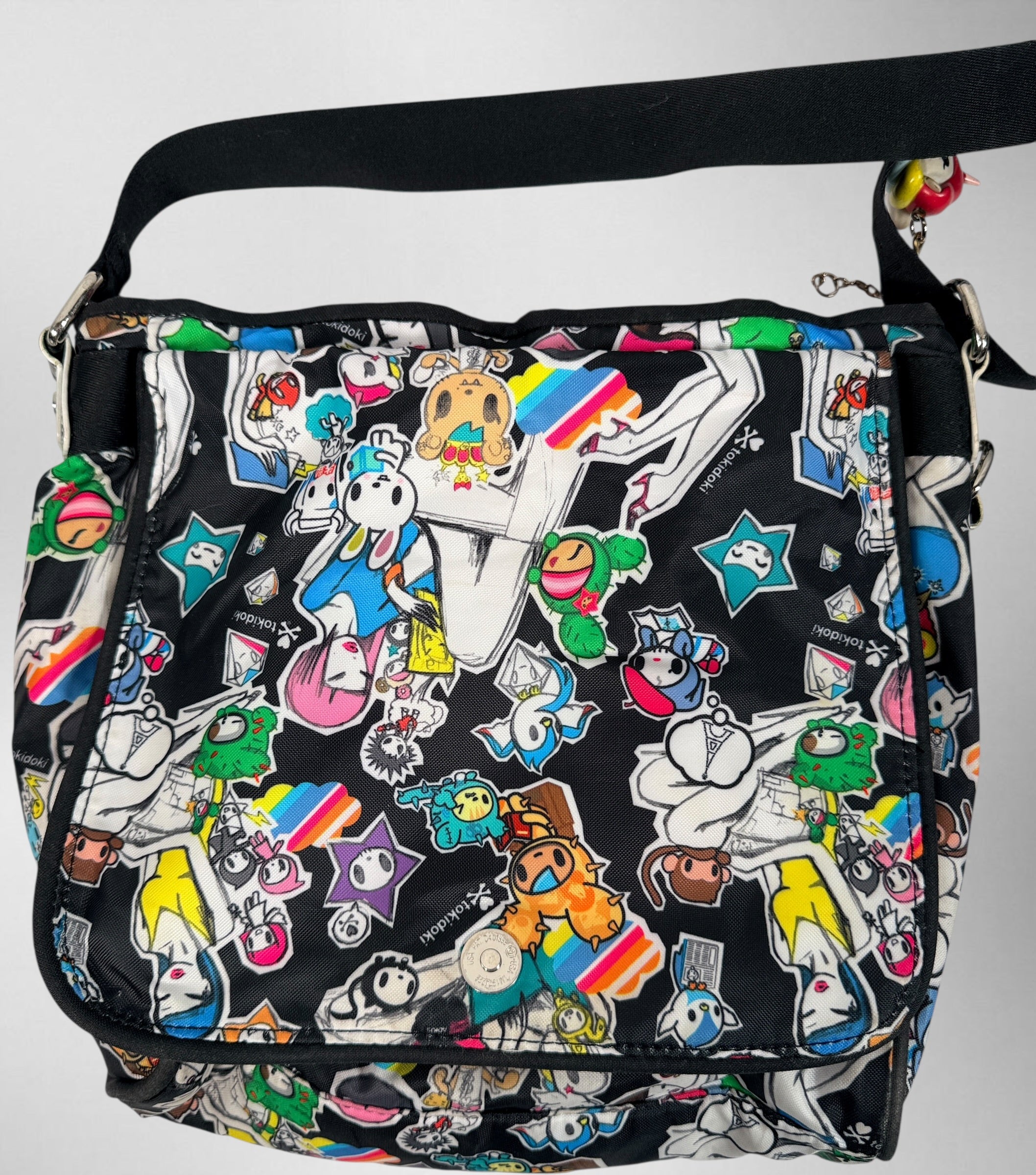 Tokidoki graphic nylon shoulder bag with character print, pink lining and charm. Designer streetwear purse in great condition, collectible fashion accessory.