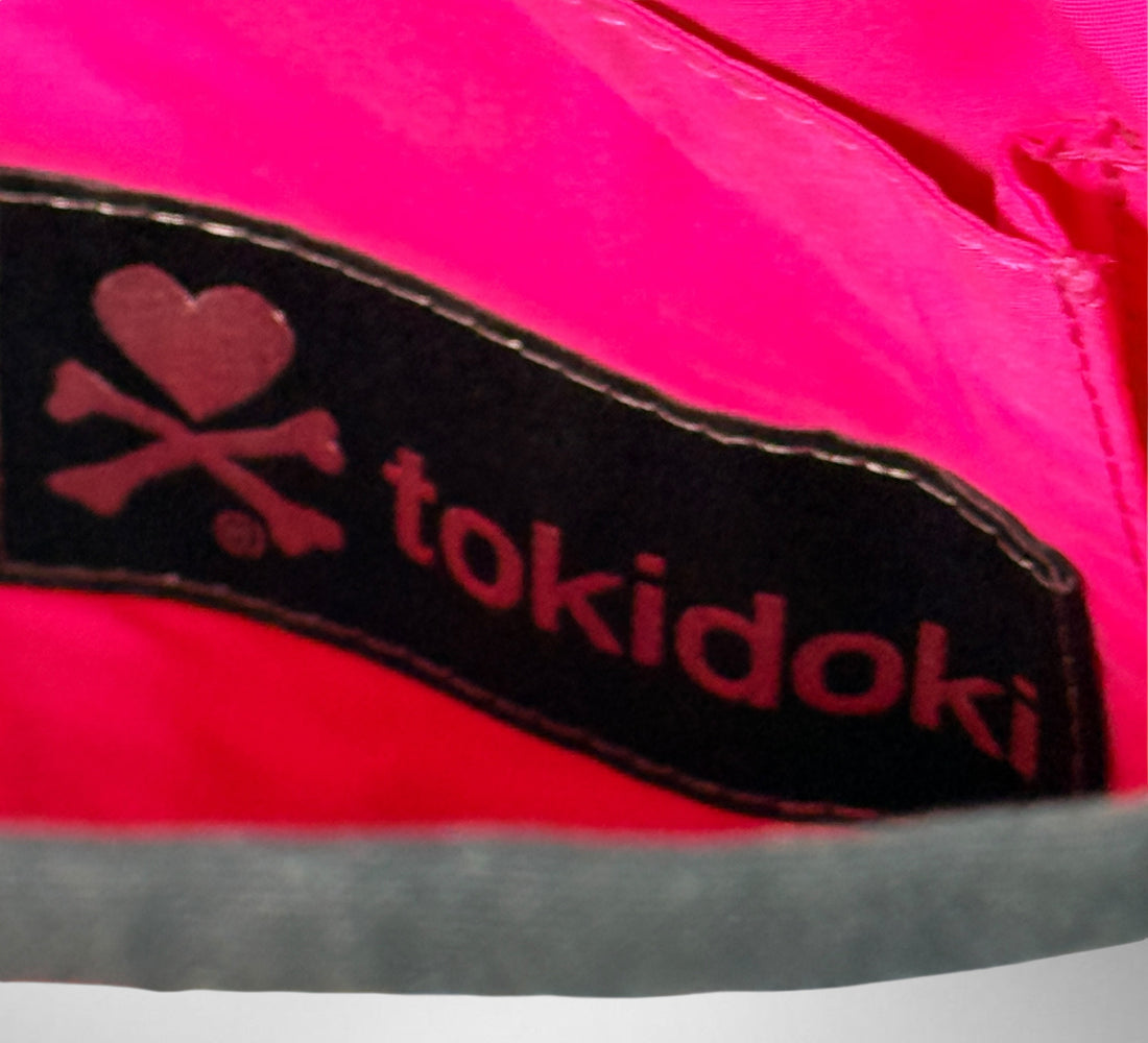 Tokidoki graphic nylon shoulder bag with character print, pink lining and charm. Designer streetwear purse in great condition, collectible fashion accessory.