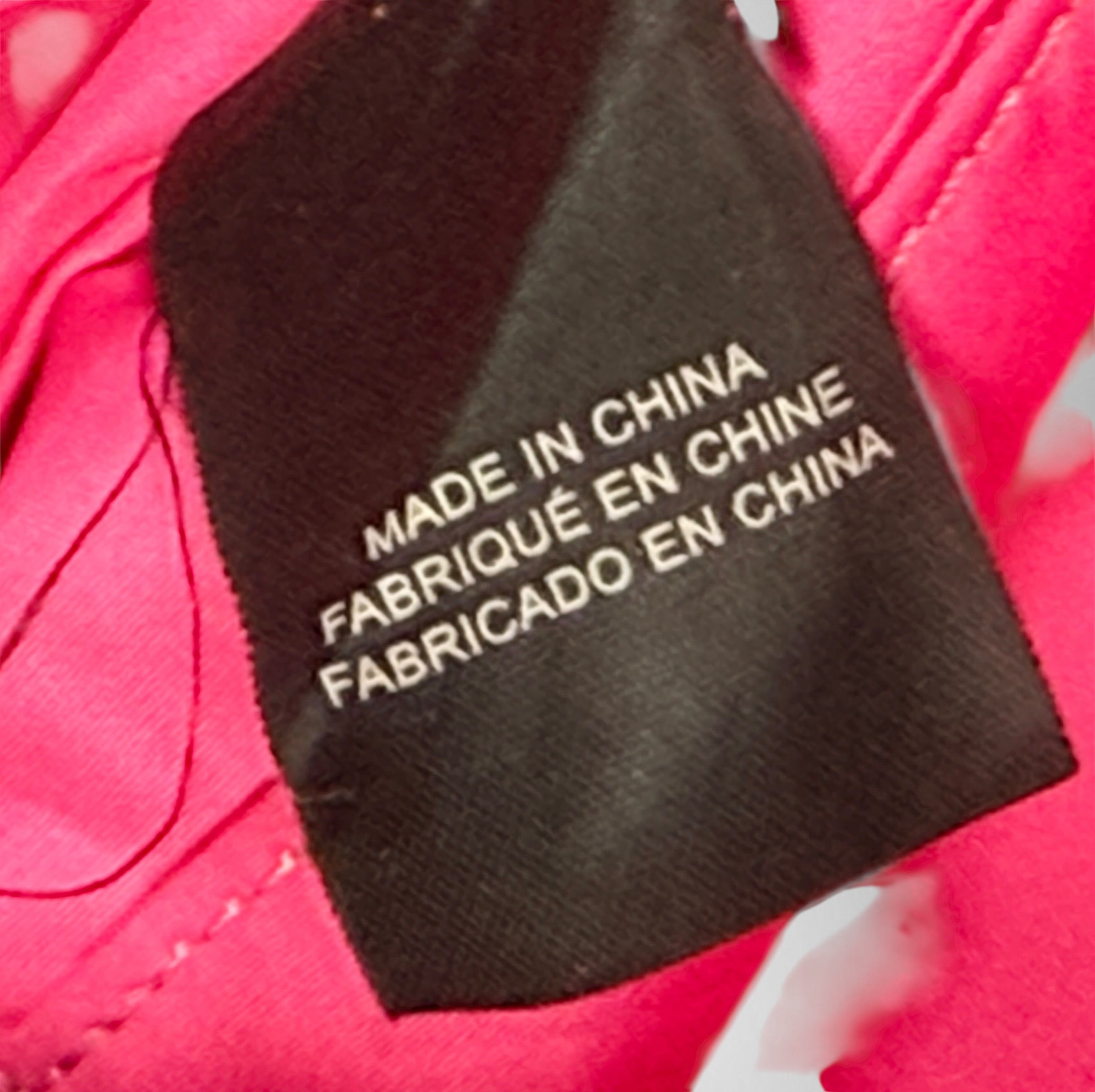 Tokidoki graphic nylon shoulder bag with character print, pink lining and charm. Designer streetwear purse in great condition, collectible fashion accessory.