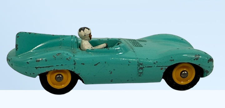 Vintage Dinky Toys #238 Jaguar D-Type racing car in turquoise. Original Meccano Ltd. die-cast model, made in England, with authentic playwear.