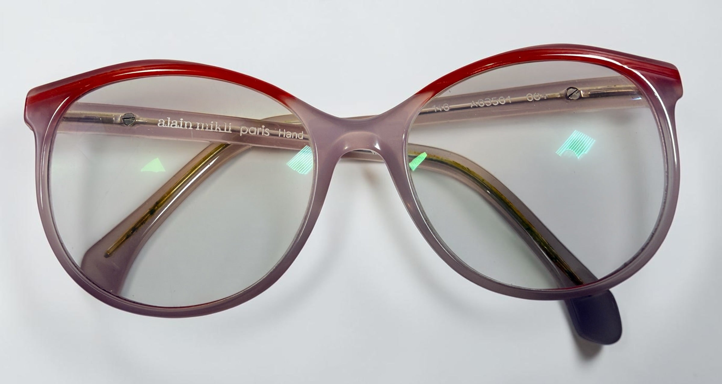 Alain Mikli A03501 004 eyeglass frame in pink and red acetate, handmade in Italy, size 54-17-140. Pre-owned with original Alain Mikli case.