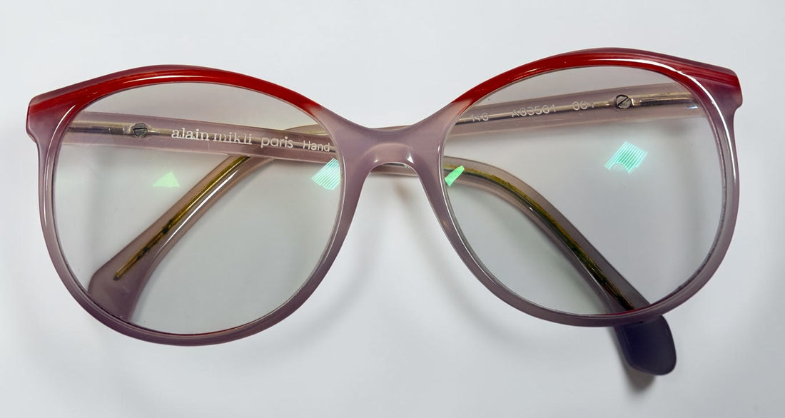 Alain Mikli A03501 004 eyeglass frame in pink and red acetate, handmade in Italy, size 54-17-140. Pre-owned with original Alain Mikli case.