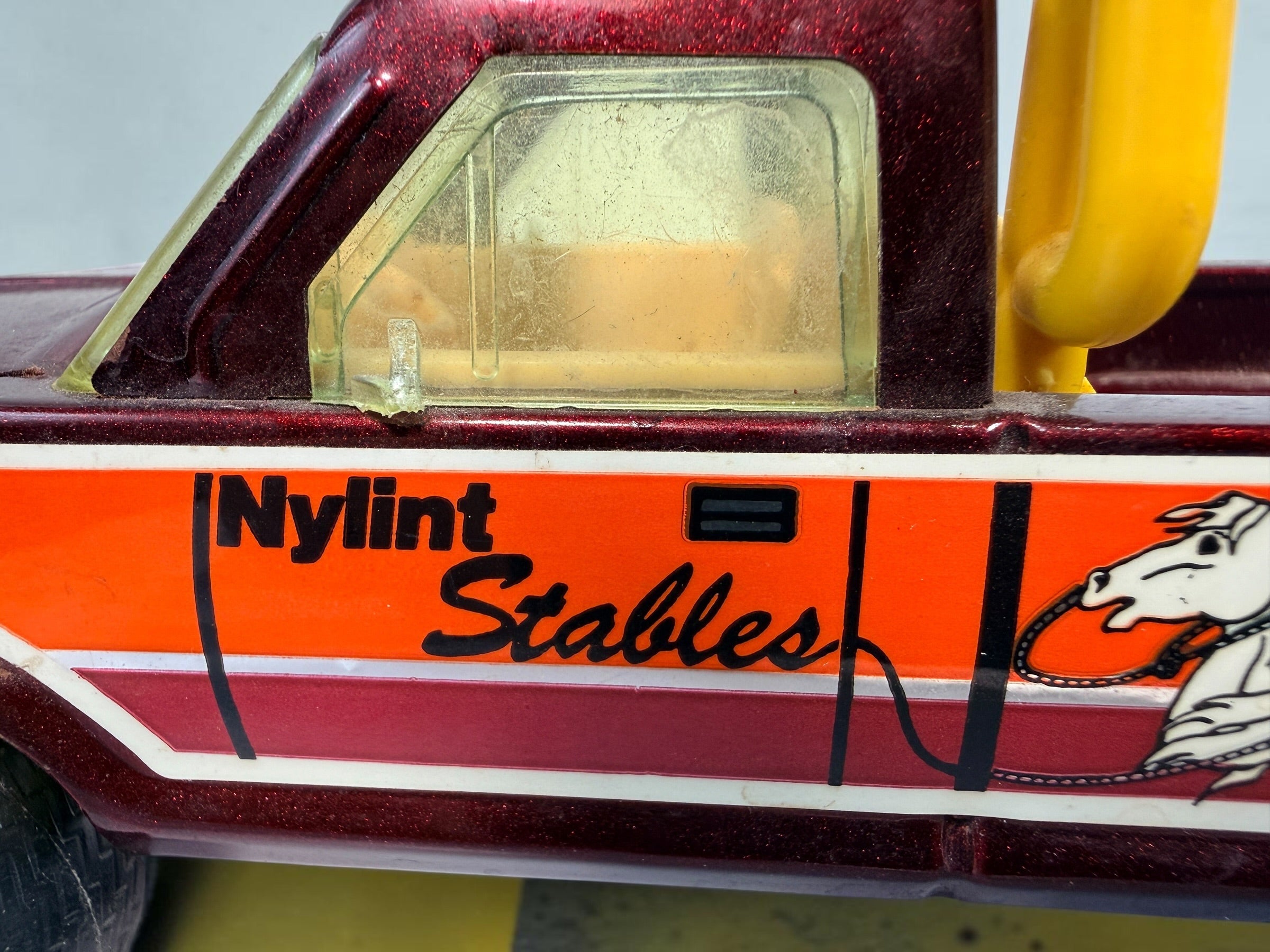 Vintage Nylint Stables Metal Muscle pressed-steel pickup truck, made in Rockford, Illinois, USA. Classic 1980s collectible toy with horse graphics.