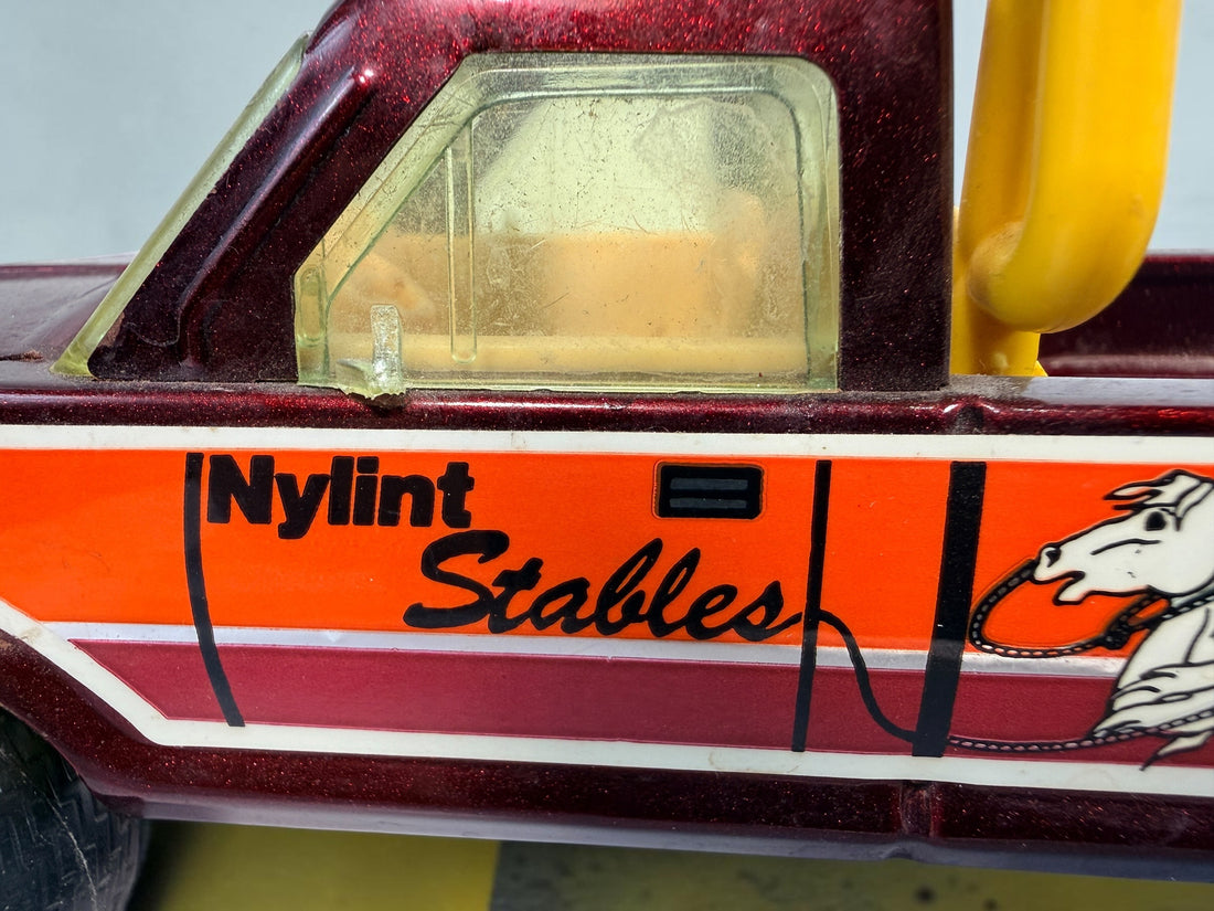 Vintage Nylint Stables Metal Muscle pressed-steel pickup truck, made in Rockford, Illinois, USA. Classic 1980s collectible toy with horse graphics.