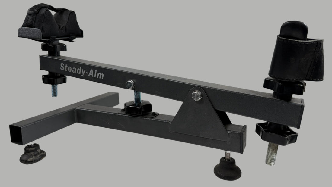 Black Steady-Aim device on a white surface with a white brick wall background