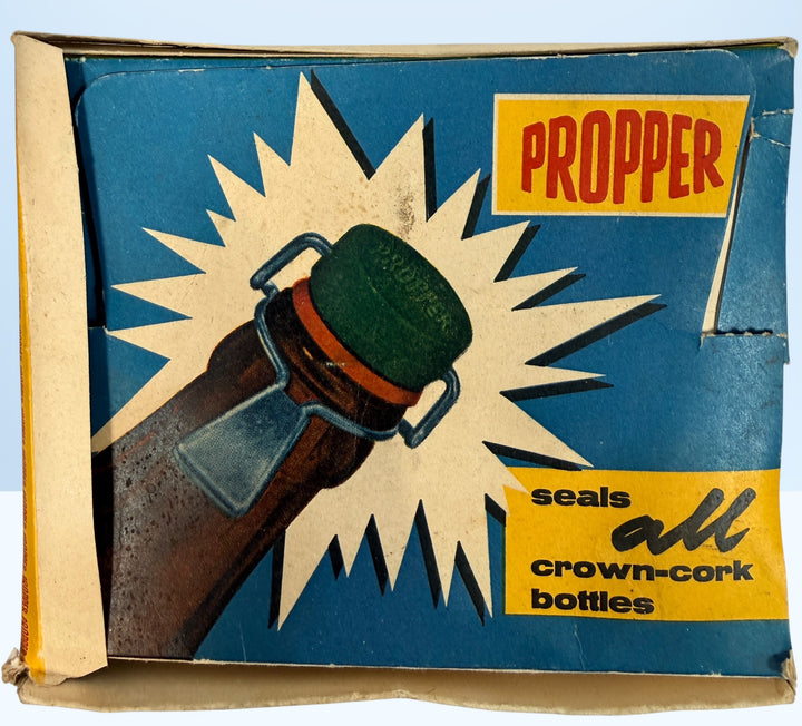 Vintage Propper swing top bottle stoppers set with original box. Retro barware bottle caps for homebrew, soda bottles, or collectible mid-century packaging.