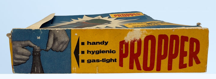 Vintage Propper swing top bottle stoppers set with original box. Retro barware bottle caps for homebrew, soda bottles, or collectible mid-century packaging.