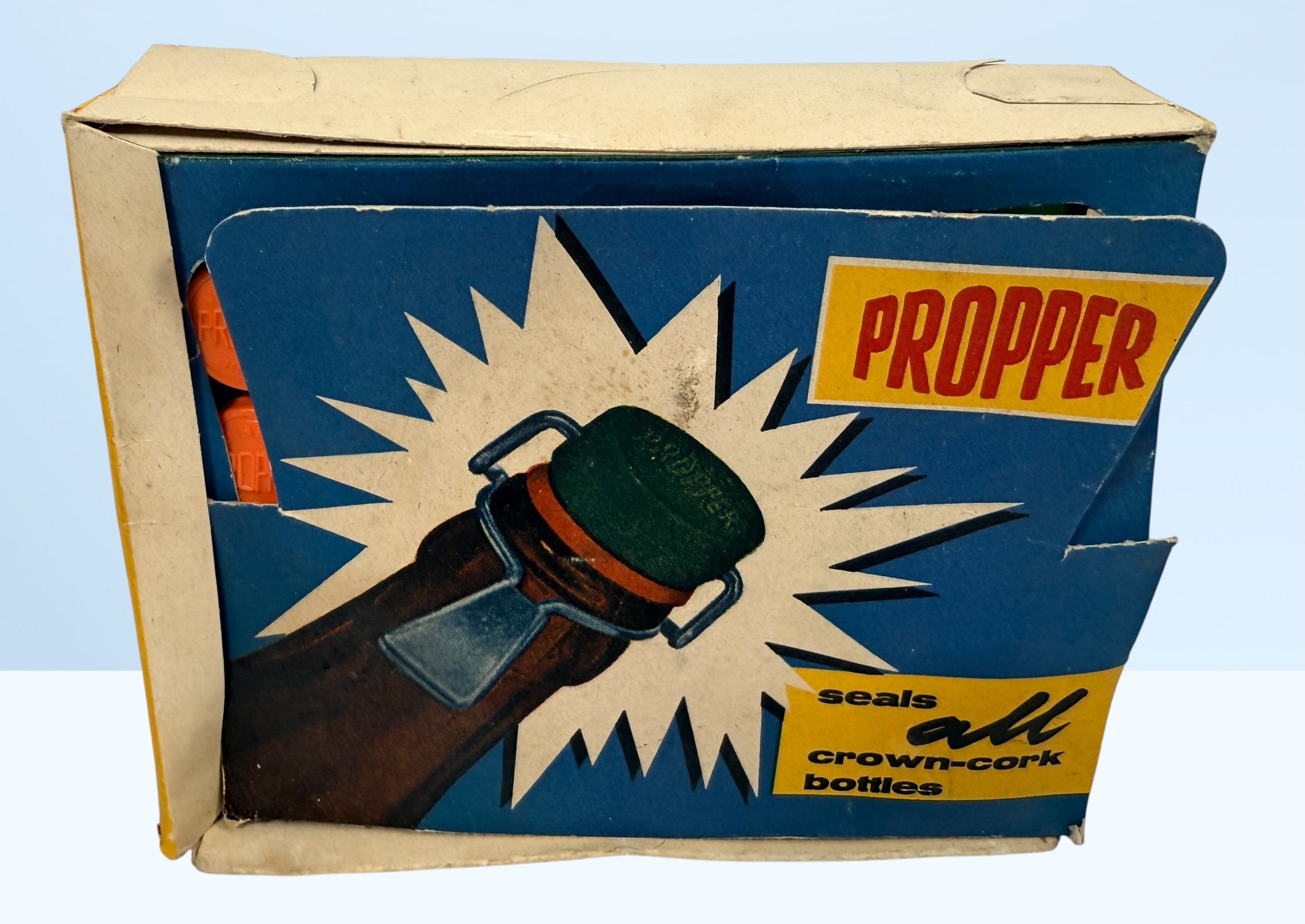 Vintage Propper swing top bottle stoppers set with original box. Retro barware bottle caps for homebrew, soda bottles, or collectible mid-century packaging.
