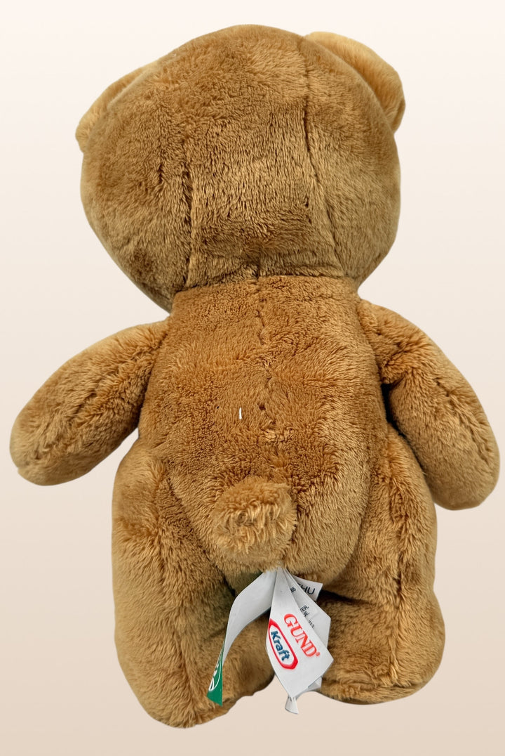 Vintage Kraft Peanut Butter GUND teddy bear plush with green bow tie. Canadian advertising collectible mascot, approx 10 inches, nostalgic branded display piece.