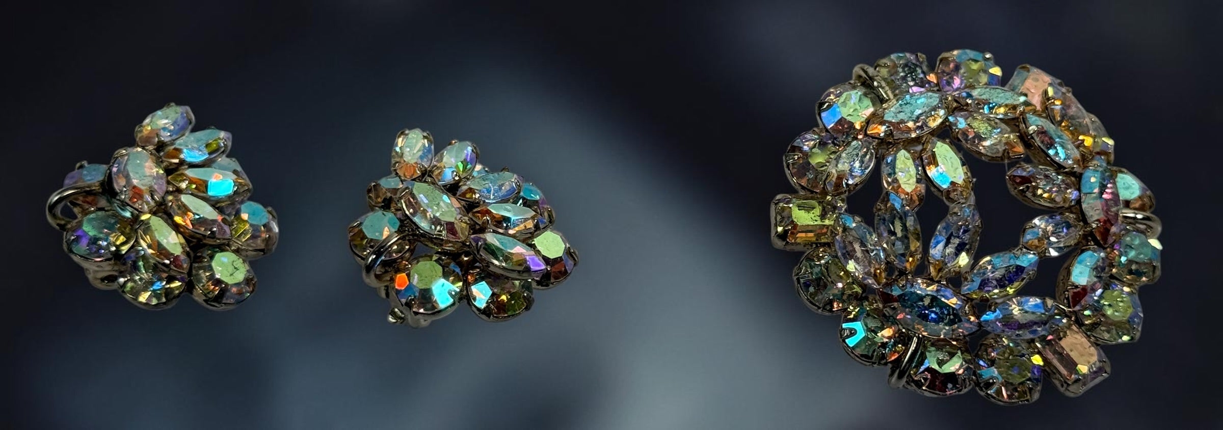 Vintage signed Sherman AB rhinestone parure with necklace, brooch and clip earrings. Mid-century Canadian costume jewelry with brilliant iridescent stones.