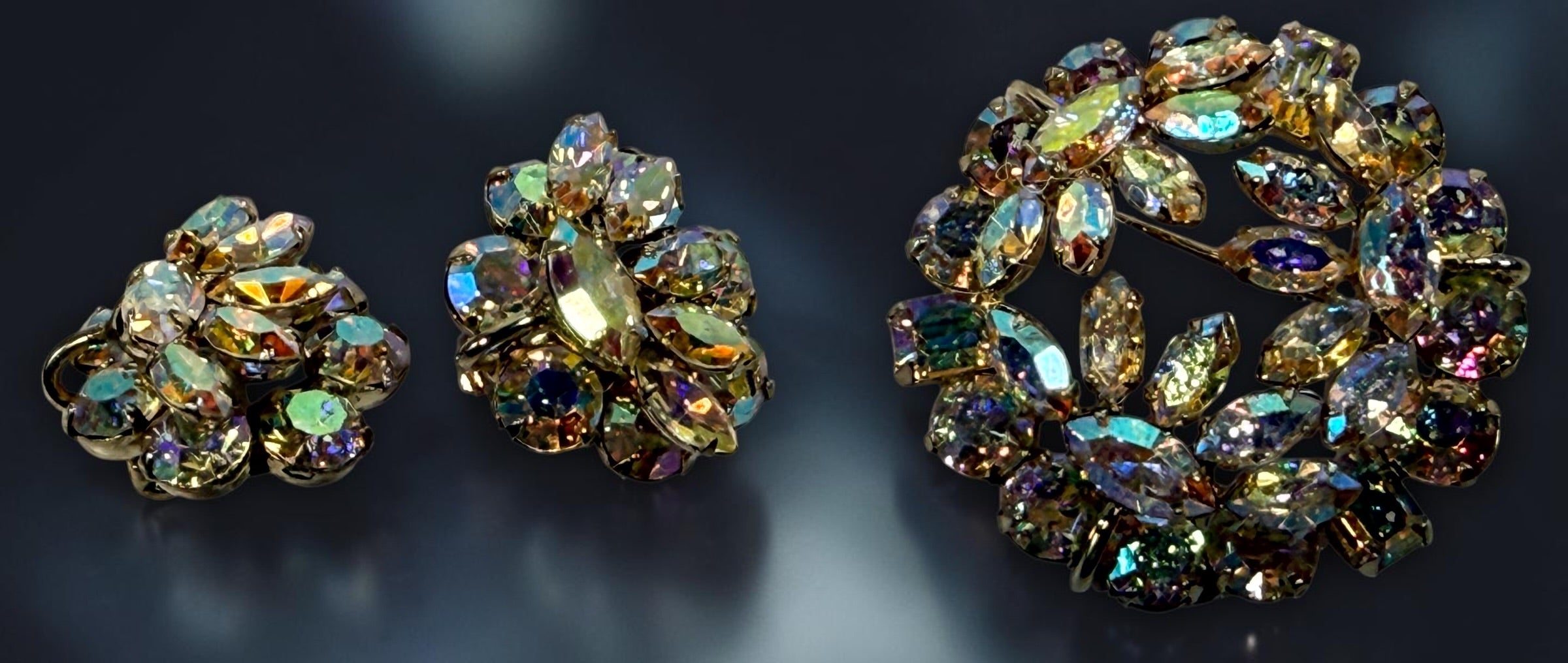 Vintage signed Sherman AB rhinestone parure with necklace, brooch and clip earrings. Mid-century Canadian costume jewelry with brilliant iridescent stones.