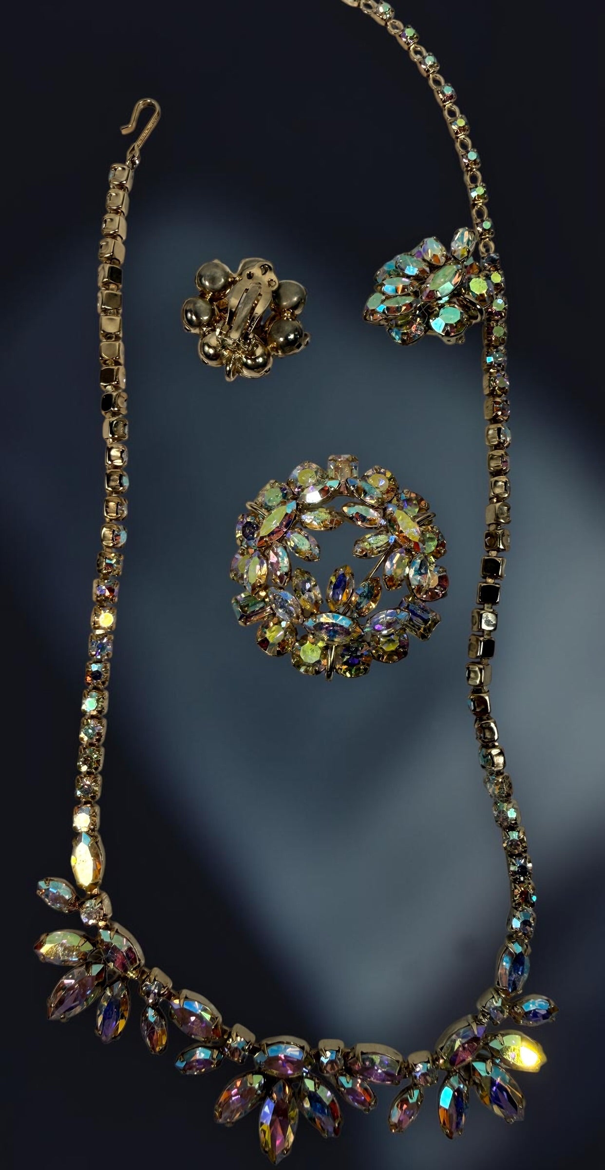 Vintage signed Sherman AB rhinestone parure with necklace, brooch and clip earrings. Mid-century Canadian costume jewelry with brilliant iridescent stones.