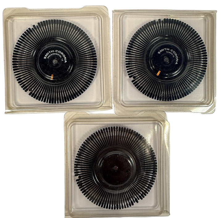 Vintage Smith Corona daisy wheel typewriter font set including Presidential 12 and Tempo 10. Original cases included. Ideal for collectors or working typewriters.