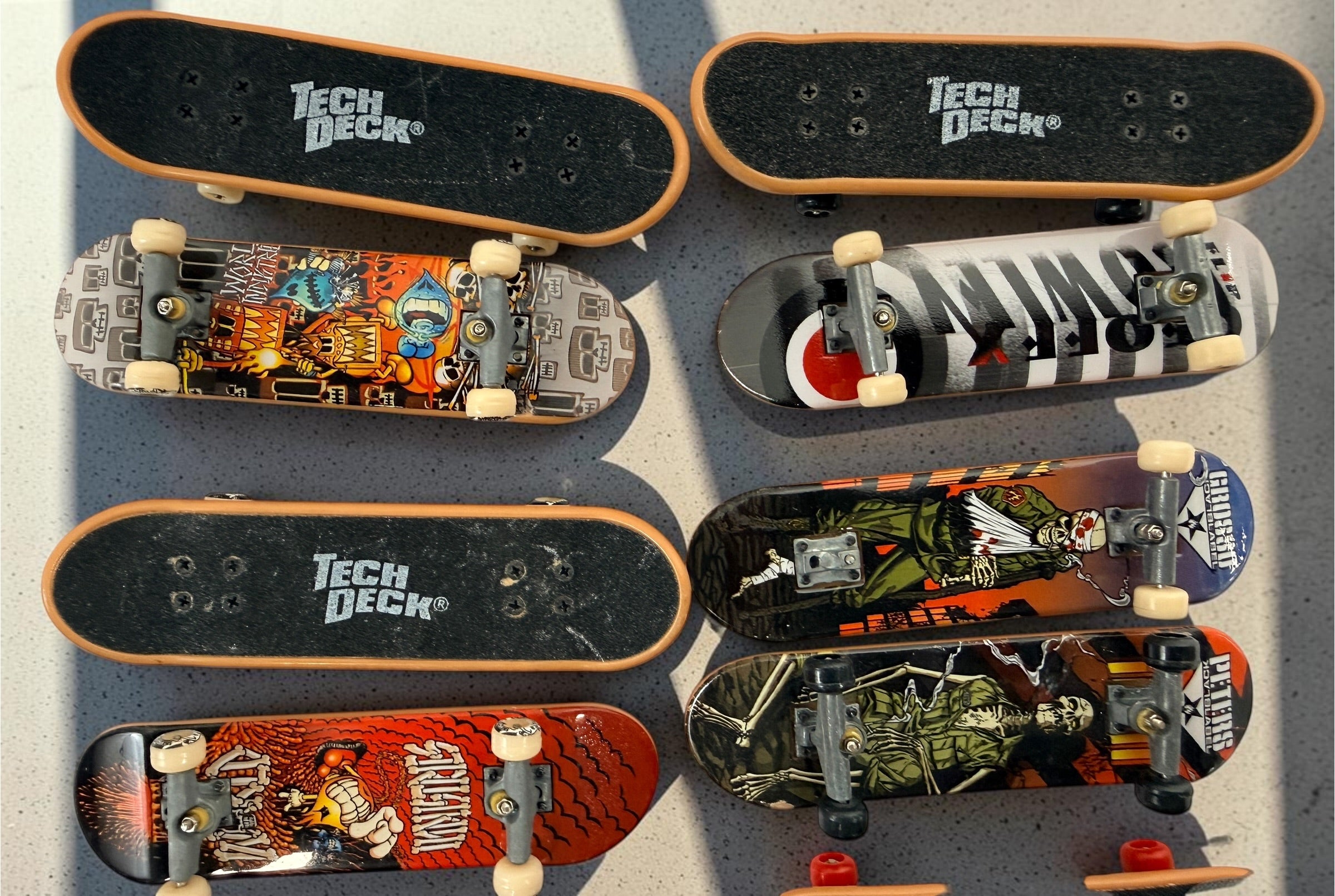 Vintage Tech Deck fingerboard collection with Blind, Flip, Baker, Chocolate, Birdhouse, World Industries boards, spare wheels, parts and tools.
