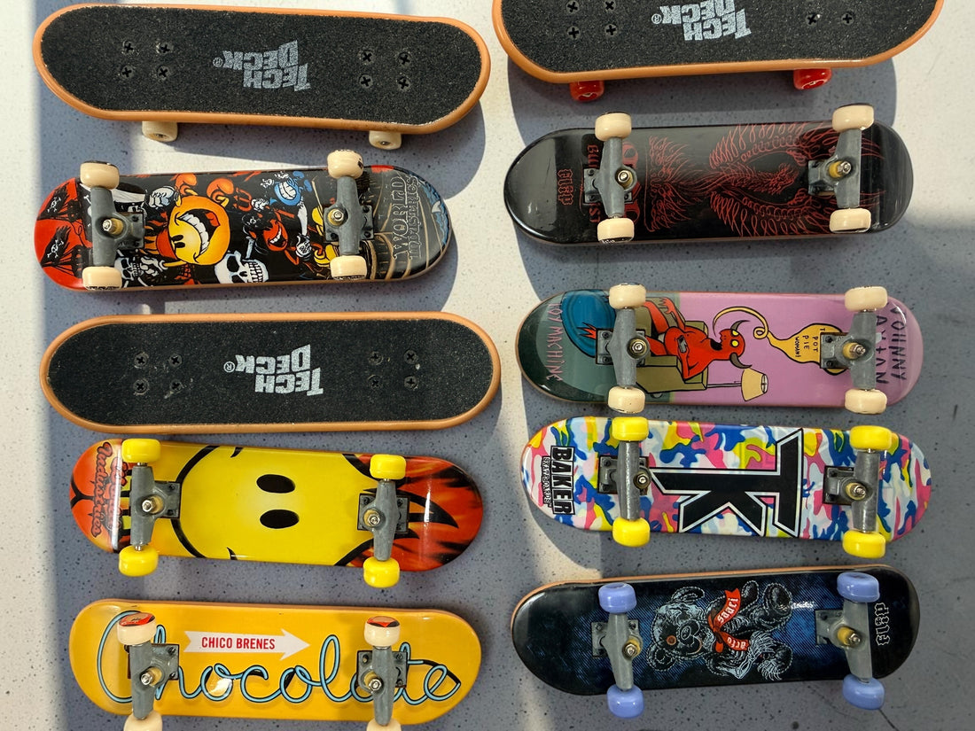 Vintage Tech Deck fingerboard collection with Blind, Flip, Baker, Chocolate, Birdhouse, World Industries boards, spare wheels, parts and tools.