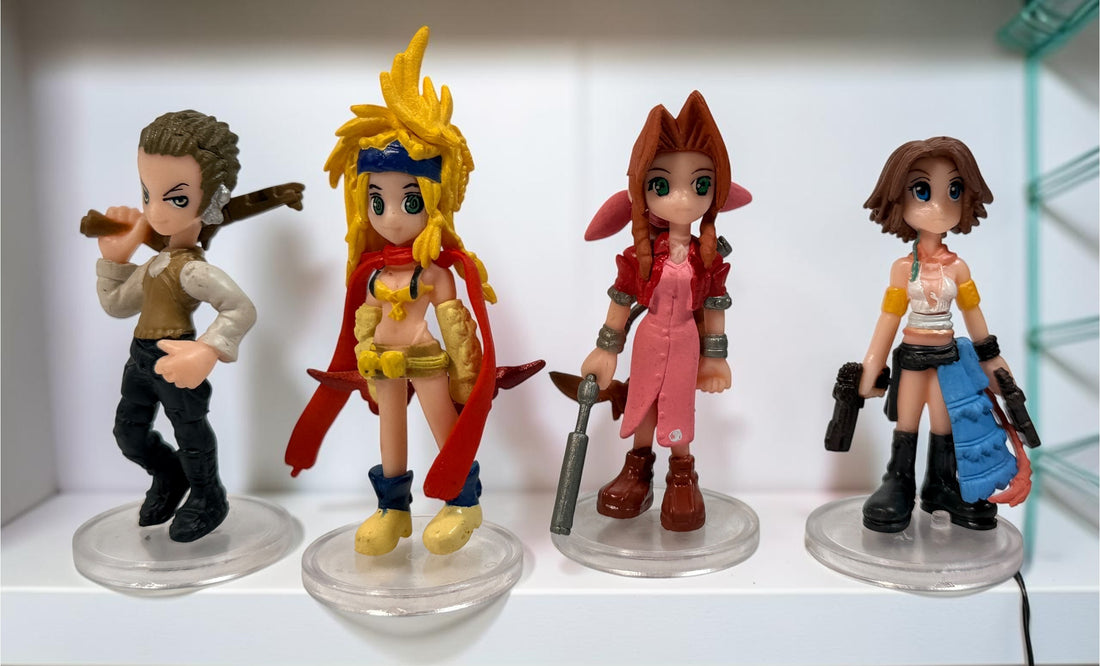 Final Fantasy lot of 10 miniature character figures with clear display stands, including Cloud and Aerith. Pre-owned collectible gaming figures.