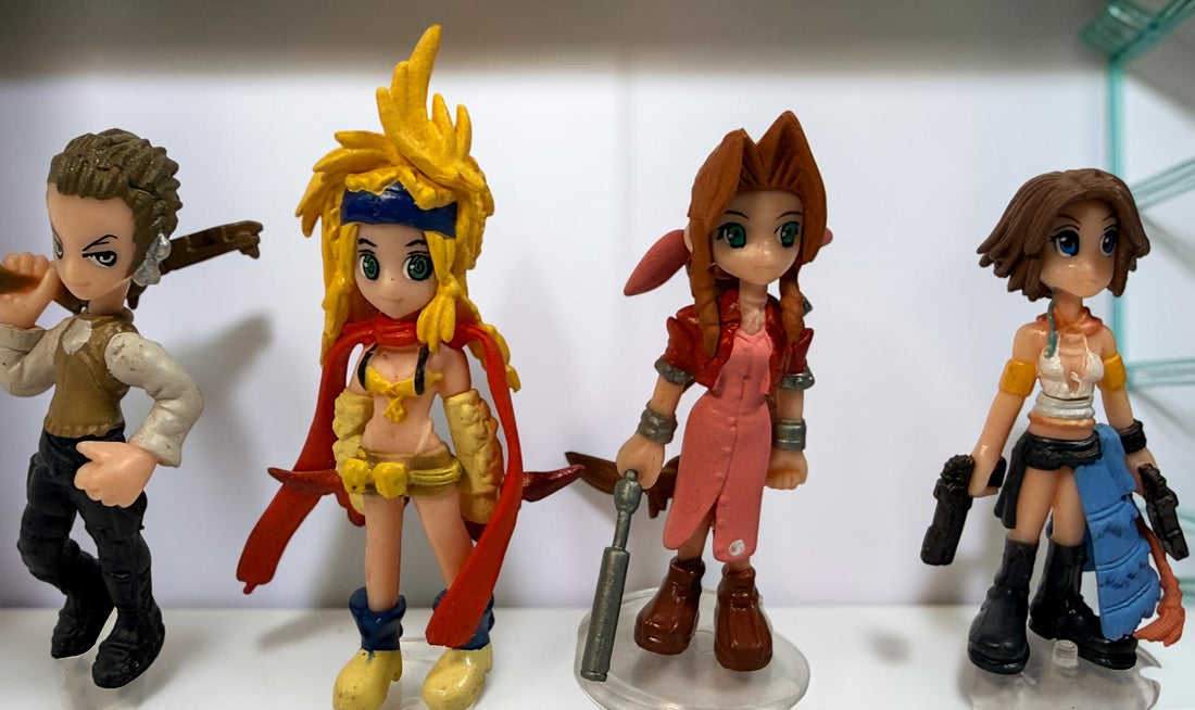 Final Fantasy lot of 10 miniature character figures with clear display stands, including Cloud and Aerith. Pre-owned collectible gaming figures.