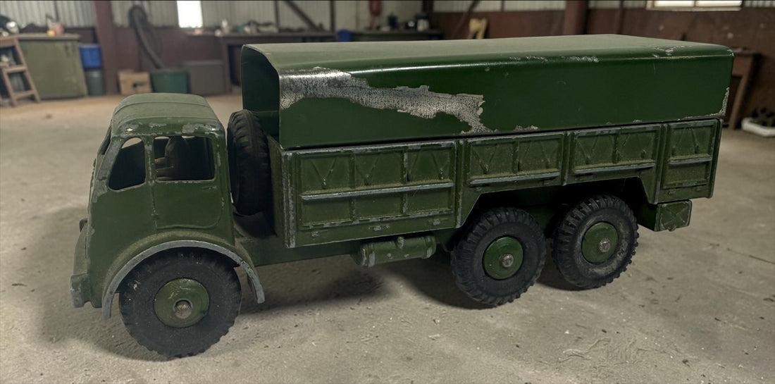 Vintage Dinky Supertoys No. 622 10-Ton Army Truck by Meccano England, with removable canopy, driver, spare wheel and authentic original wear.