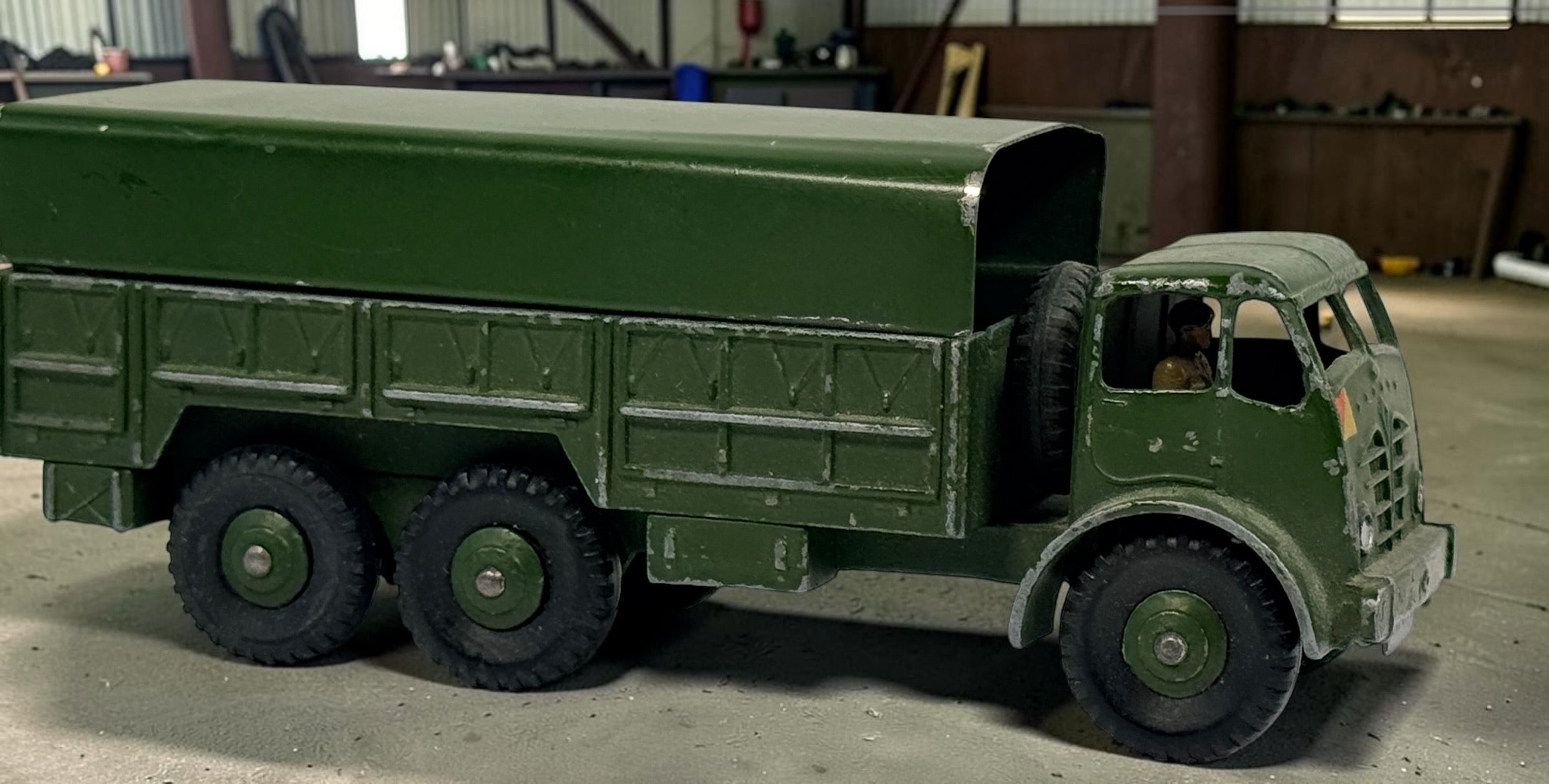 Vintage Dinky Supertoys No. 622 10-Ton Army Truck by Meccano England, with removable canopy, driver, spare wheel and authentic original wear.