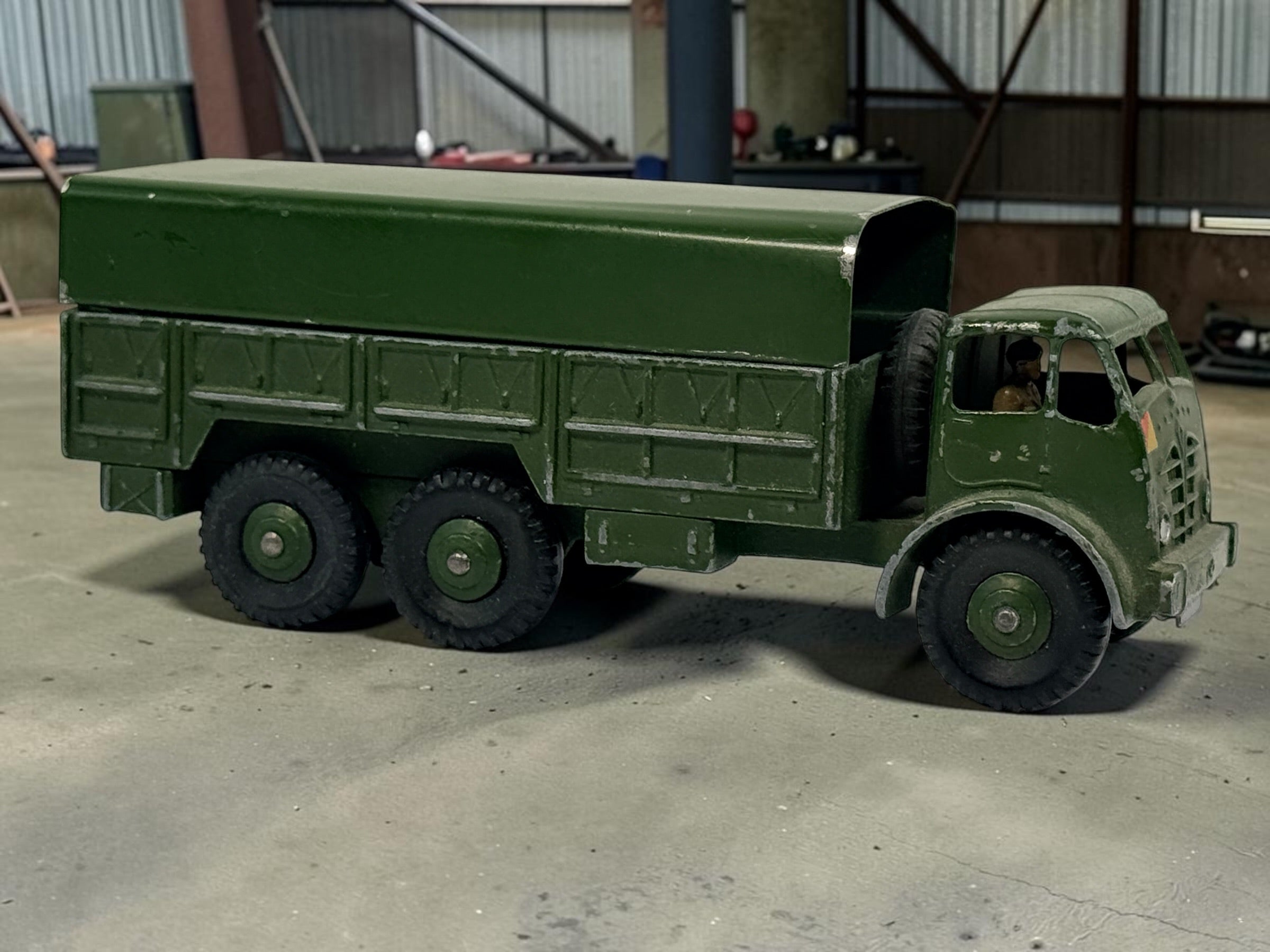Vintage Dinky Supertoys No. 622 10-Ton Army Truck by Meccano England, with removable canopy, driver, spare wheel and authentic original wear.