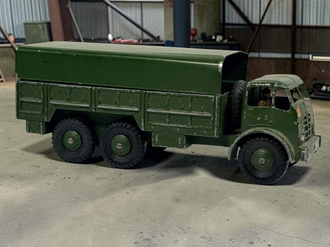 Vintage Dinky Supertoys No. 622 10-Ton Army Truck by Meccano England, with removable canopy, driver, spare wheel and authentic original wear.