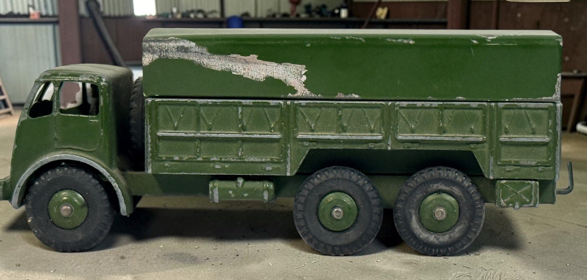 Vintage Dinky Supertoys No. 622 10-Ton Army Truck by Meccano England, with removable canopy, driver, spare wheel and authentic original wear.