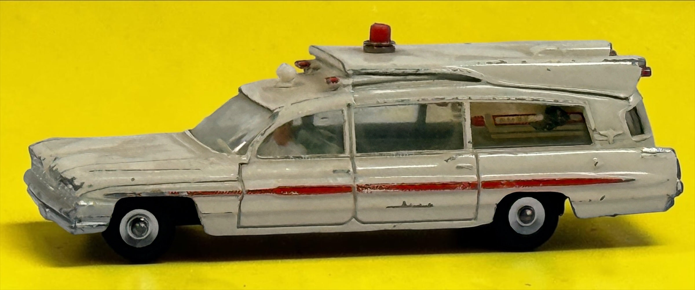 Vintage 1960s Dinky Toys No. 263 Superior Criterion Ambulance by Meccano Ltd., Made in England. Original die-cast model with authentic play wear.