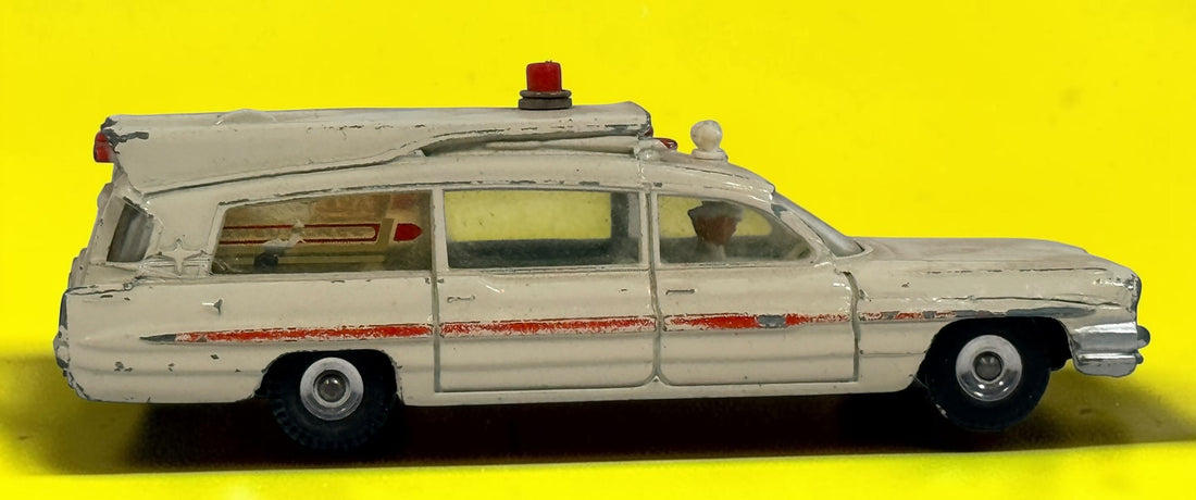 Vintage 1960s Dinky Toys No. 263 Superior Criterion Ambulance by Meccano Ltd., Made in England. Original die-cast model with authentic play wear.