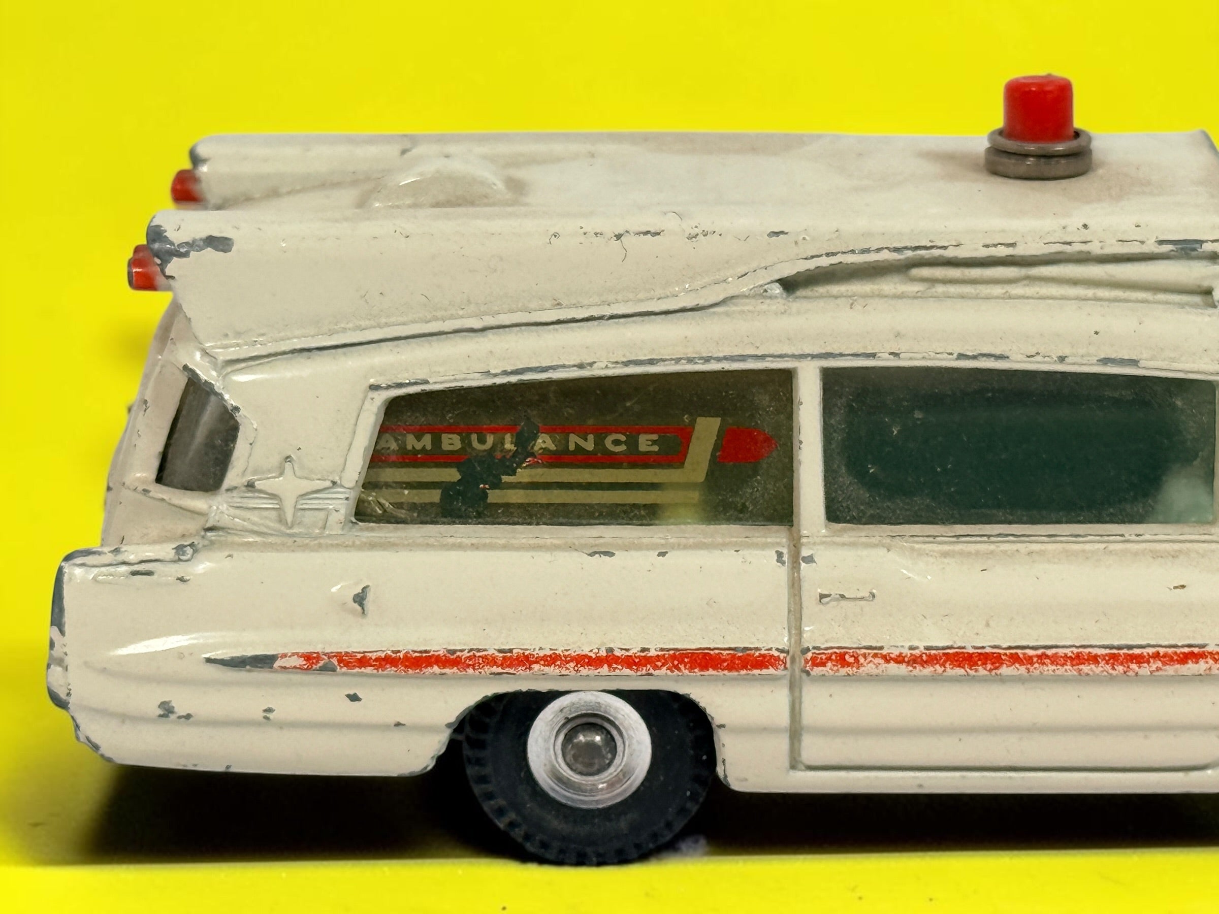 Vintage 1960s Dinky Toys No. 263 Superior Criterion Ambulance by Meccano Ltd., Made in England. Original die-cast model with authentic play wear.