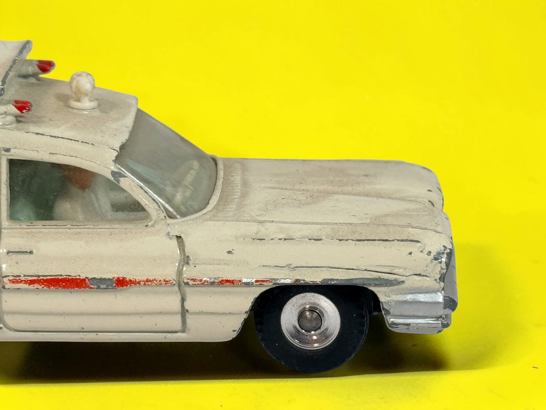 Vintage 1960s Dinky Toys No. 263 Superior Criterion Ambulance by Meccano Ltd., Made in England. Original die-cast model with authentic play wear.