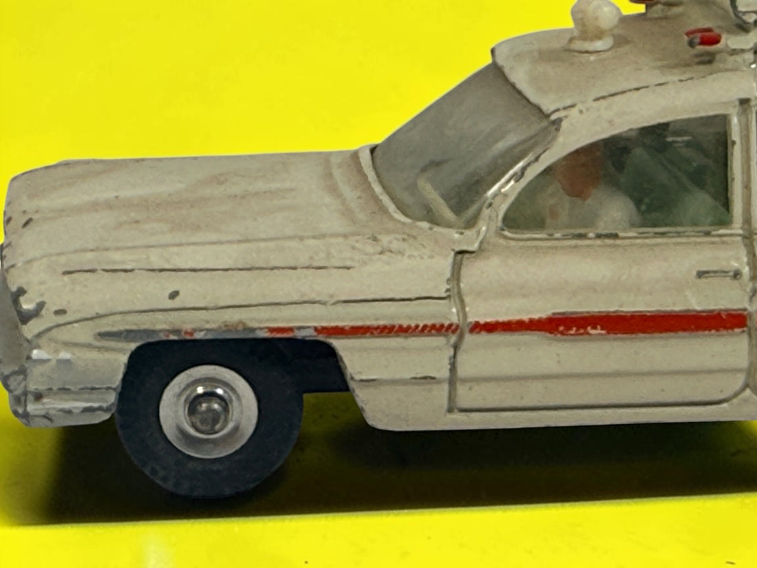 Vintage 1960s Dinky Toys No. 263 Superior Criterion Ambulance by Meccano Ltd., Made in England. Original die-cast model with authentic play wear.
