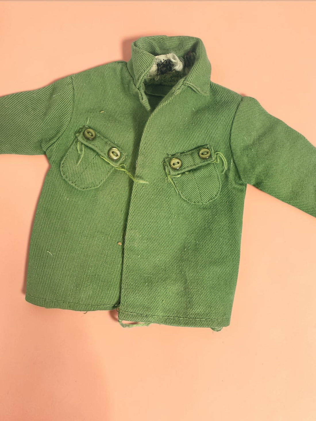 Vintage Hasbro G.I. Joe 12-inch clothing and accessory lot with Hong Kong tags, military uniforms, flight suits and campfire accessory. Original vintage pieces.