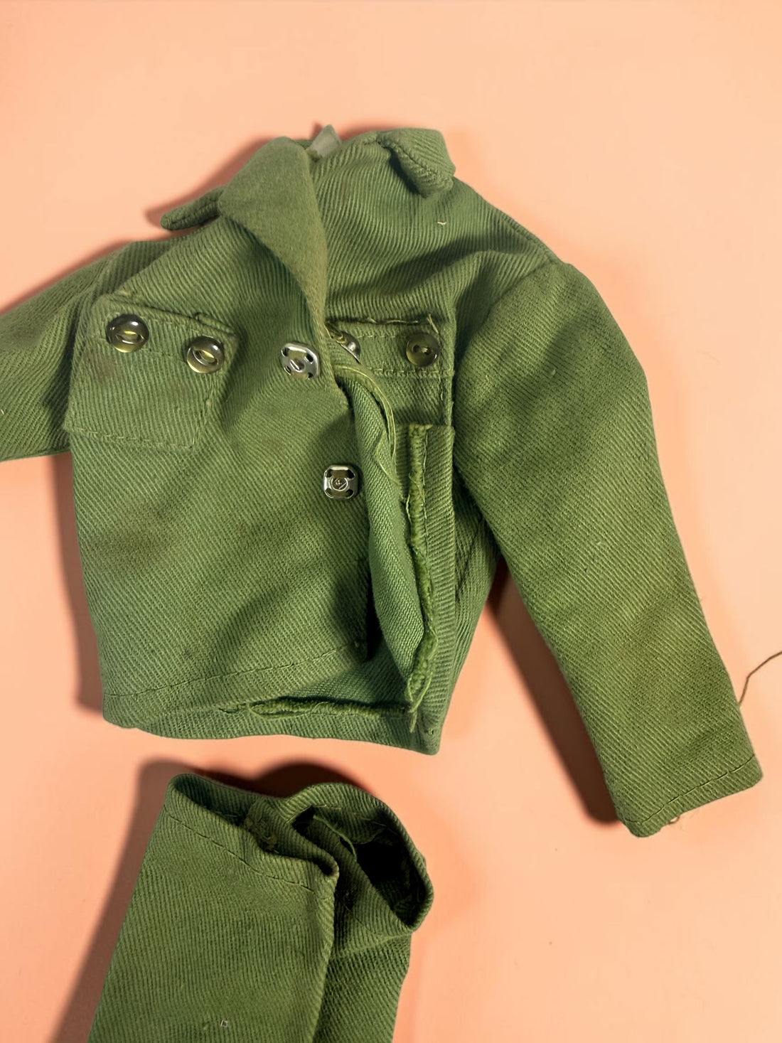 Vintage Hasbro G.I. Joe 12-inch clothing and accessory lot with Hong Kong tags, military uniforms, flight suits and campfire accessory. Original vintage pieces.