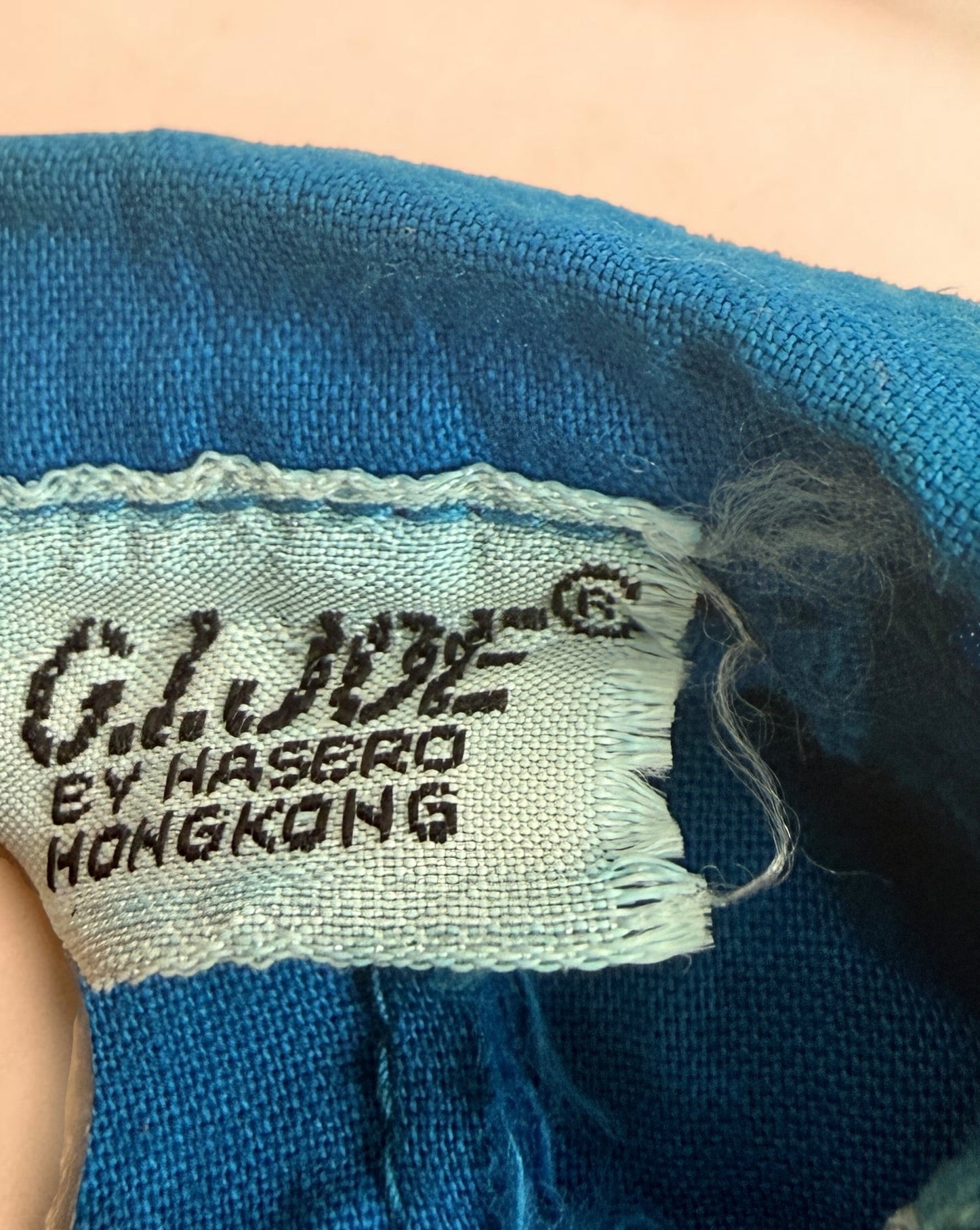 Vintage Hasbro G.I. Joe 12-inch clothing and accessory lot with Hong Kong tags, military uniforms, flight suits and campfire accessory. Original vintage pieces.