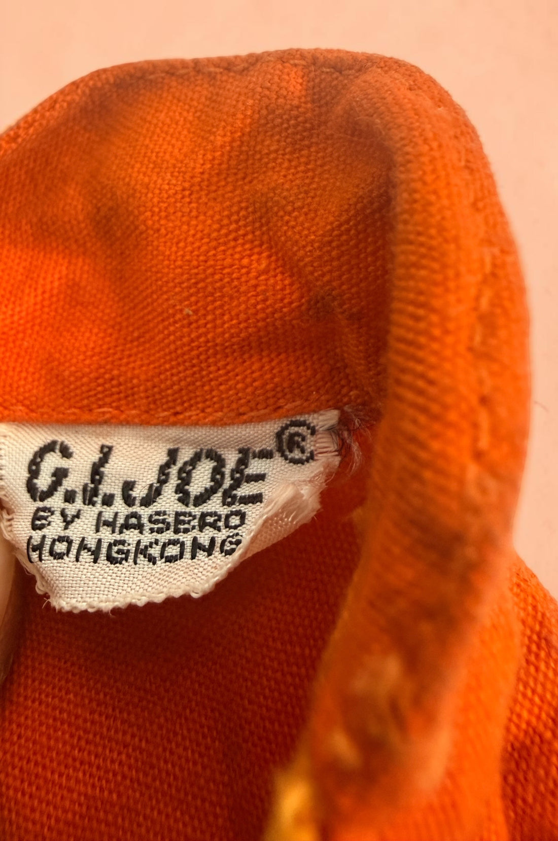 Vintage Hasbro G.I. Joe 12-inch clothing and accessory lot with Hong Kong tags, military uniforms, flight suits and campfire accessory. Original vintage pieces.