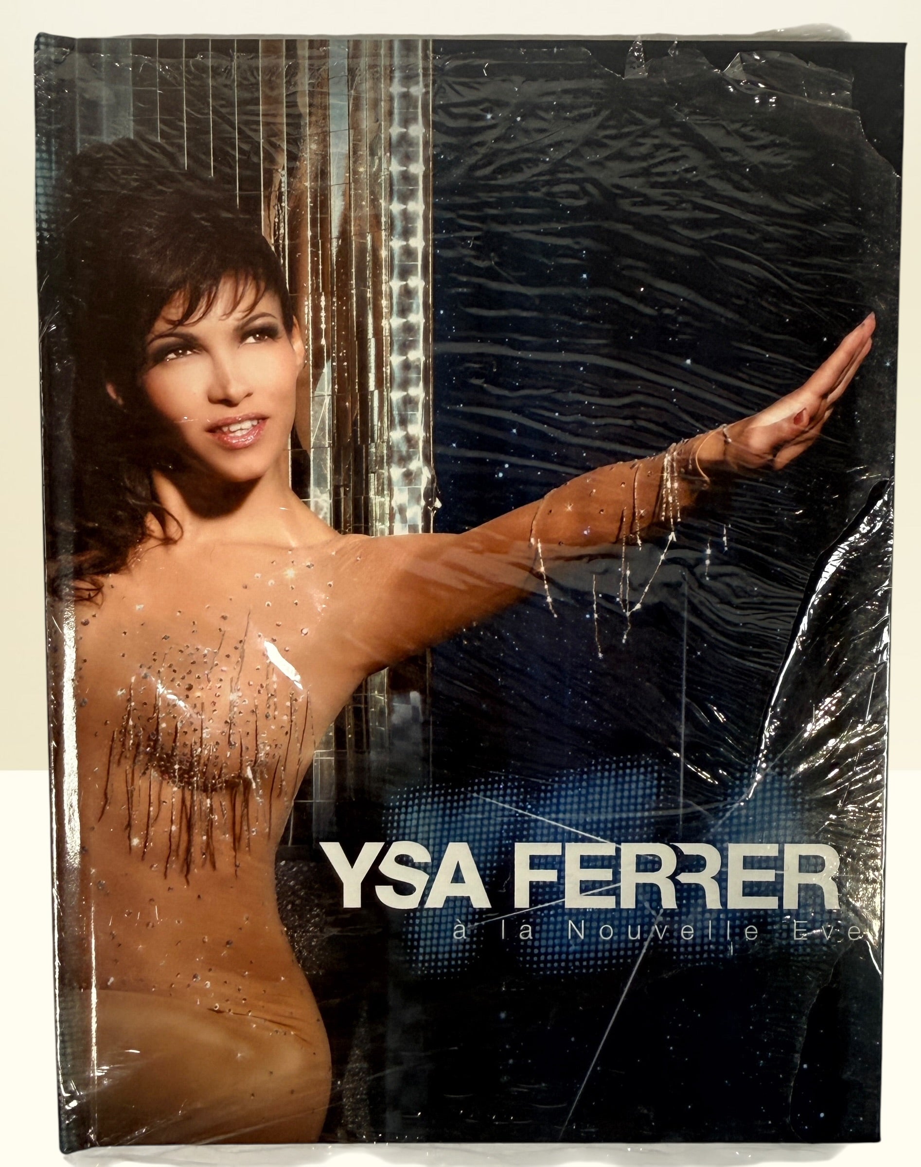 Sealed Ysa Ferrer La Nouvelle Eve concert DVD deluxe edition. French pop live performance collectible with bonus footage. Great condition with minor wrap wear.