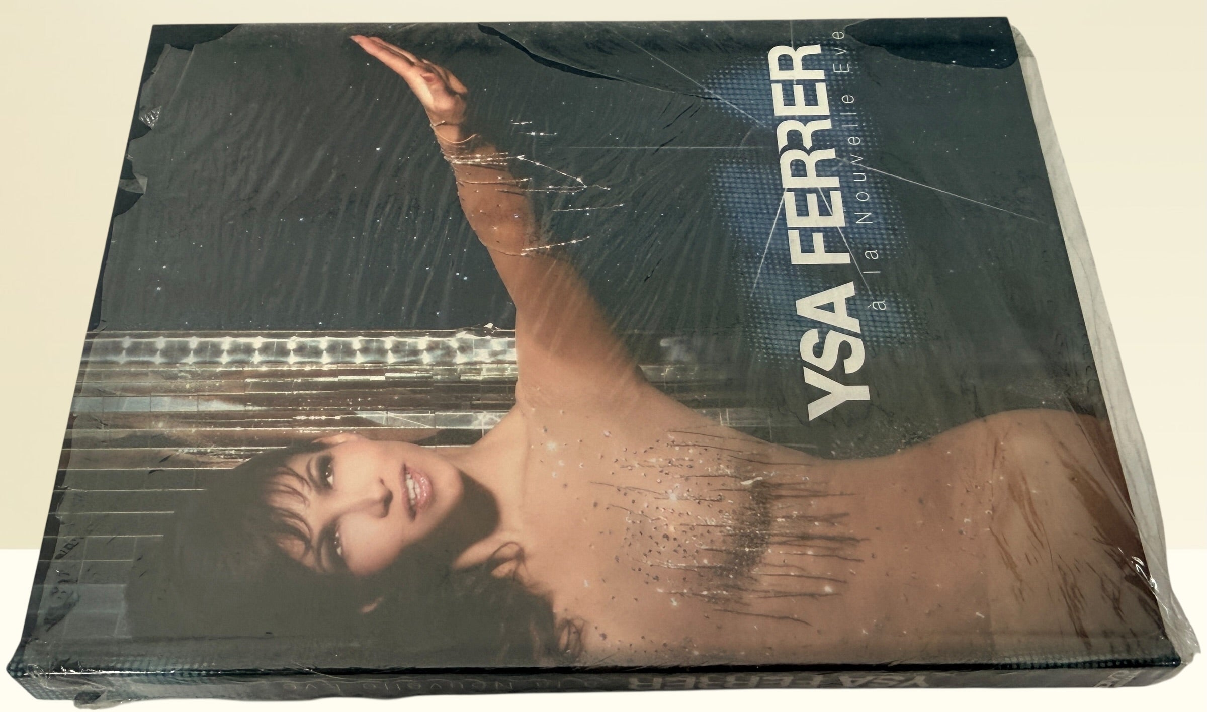 Sealed Ysa Ferrer La Nouvelle Eve concert DVD deluxe edition. French pop live performance collectible with bonus footage. Great condition with minor wrap wear.