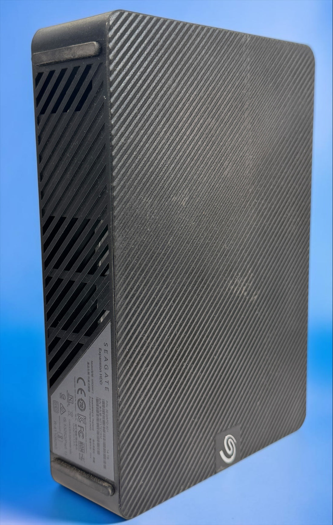 Tested Seagate Expansion 14TB external HDD, model SRD0NF2. 2024 high-capacity desktop storage drive. HDD only; cables and power adapter not included.
