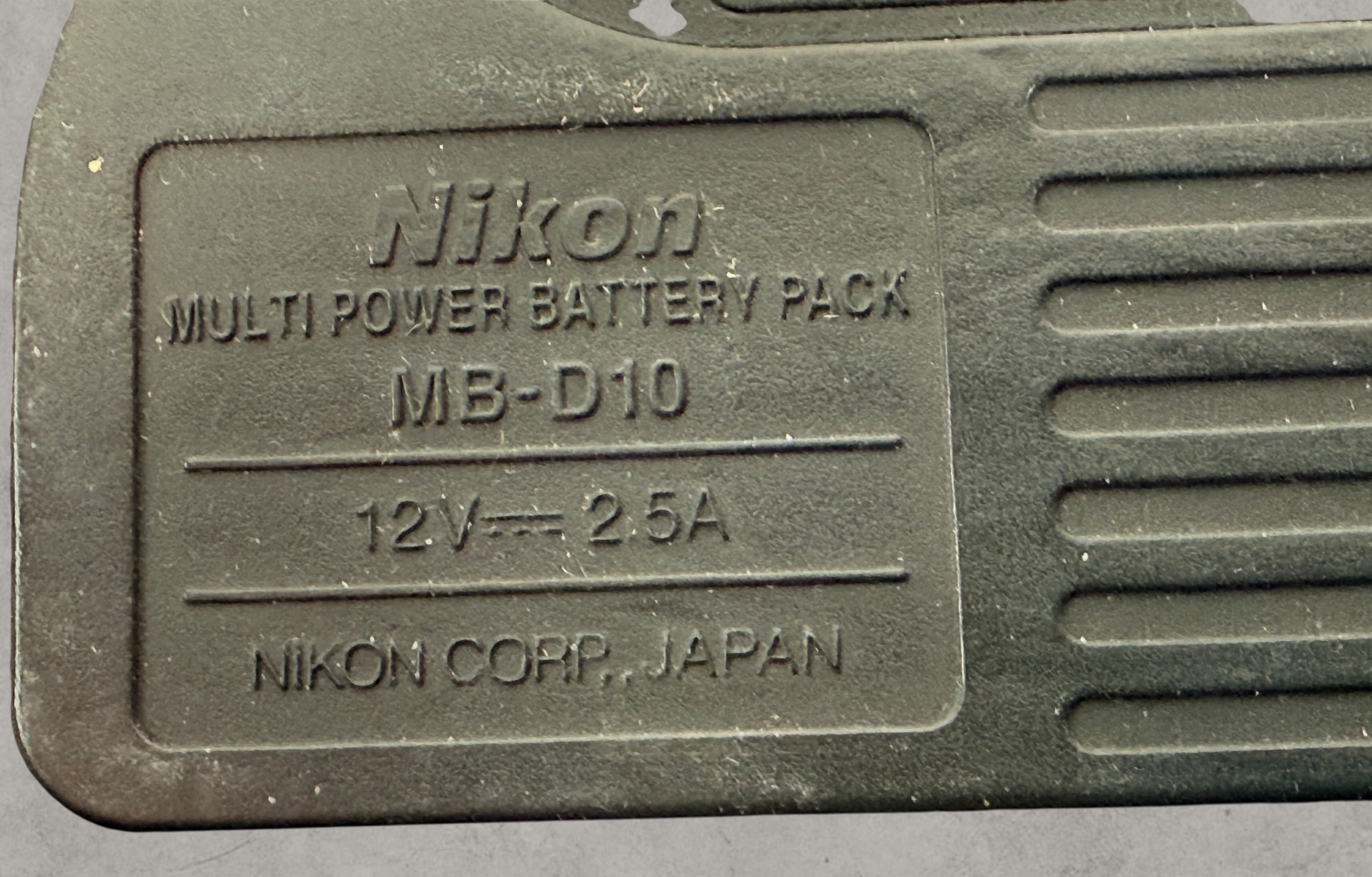 Nikon MB-D10 battery grip for D300 and D700 DSLR cameras. Genuine vertical grip sold AS-IS. Great replacement or parts unit for Nikon photographers.