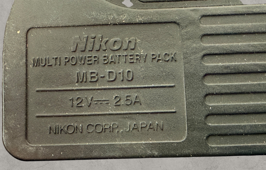 Nikon MB-D10 battery grip for D300 and D700 DSLR cameras. Genuine vertical grip sold AS-IS. Great replacement or parts unit for Nikon photographers.
