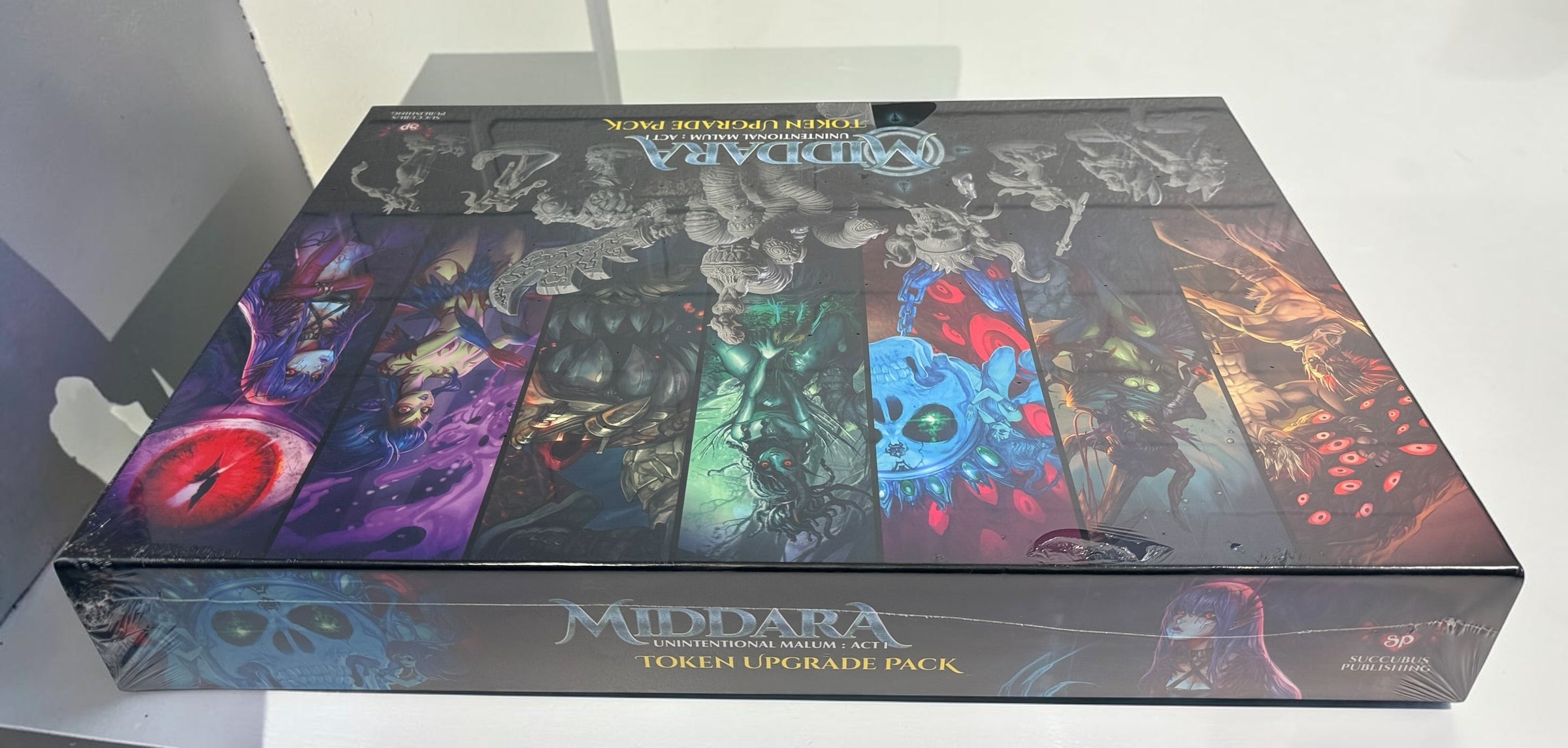 Middara Act 1 Token Upgrade Pack by Succubus Publishing with 32 plastic miniatures and 8 base rings. Factory sealed with damaged shrink wrap.
