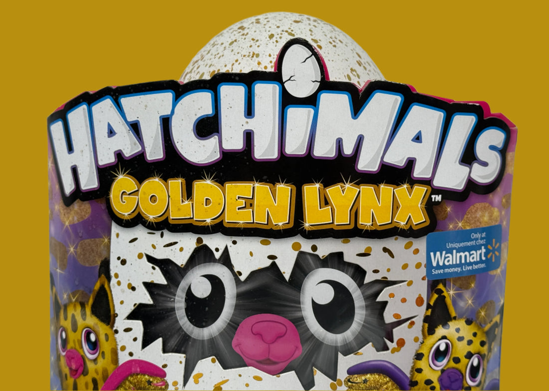 Hatchimals Golden Lynx toy packaging with Walmart logo on a white brick wall background