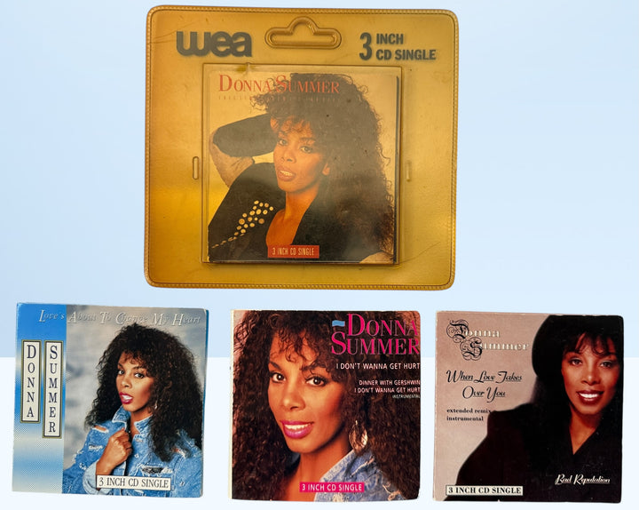 Vintage Donna Summer 3-inch CD singles lot, late 1980s WEA Germany pressings including one sealed copy. Collectible mini CD pop format set.