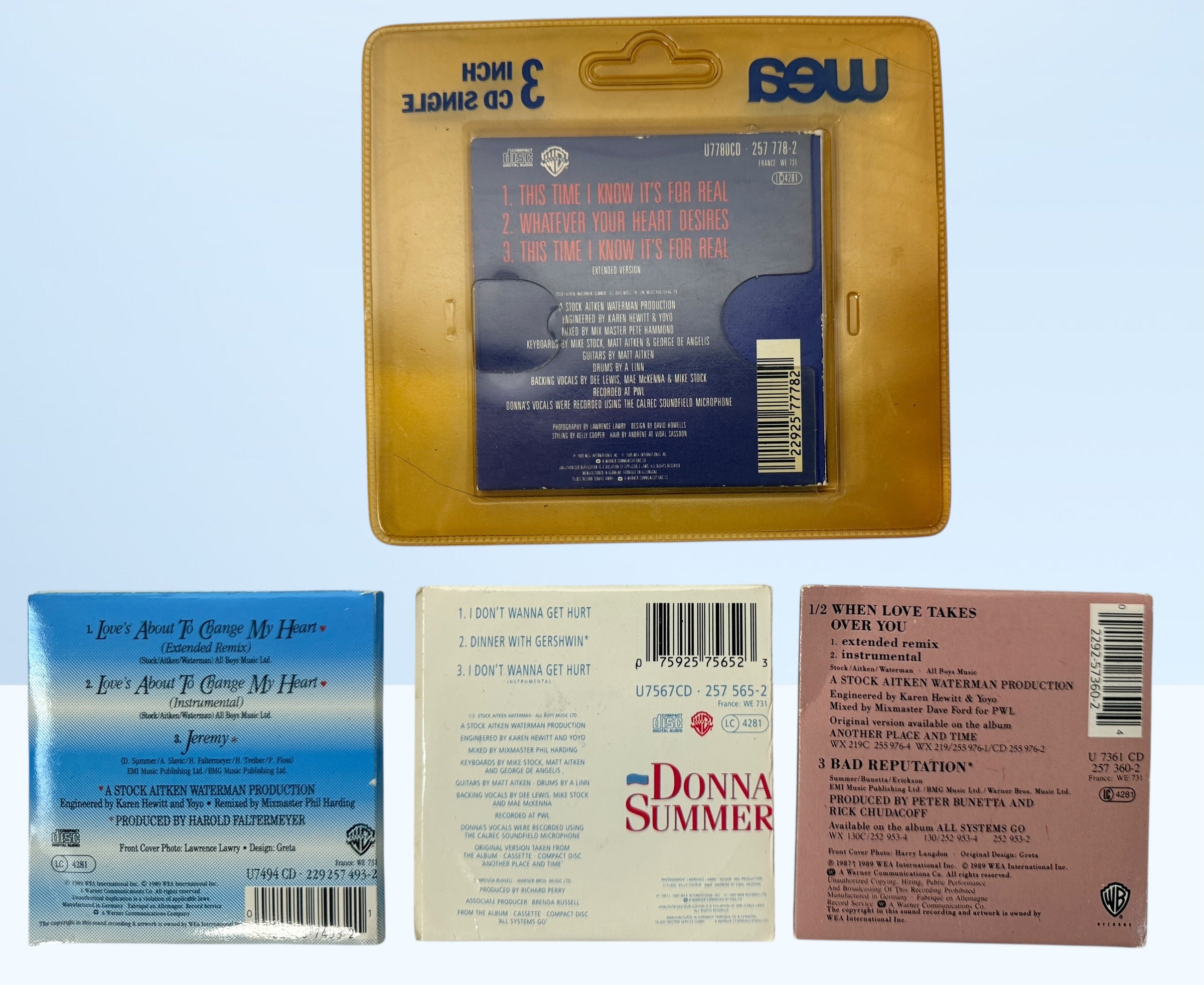 Vintage Donna Summer 3-inch CD singles lot, late 1980s WEA Germany pressings including one sealed copy. Collectible mini CD pop format set.